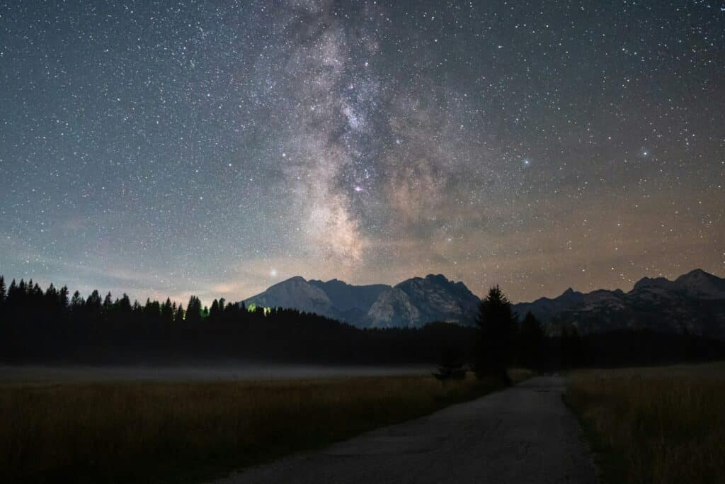 night sky with milky way above mountain